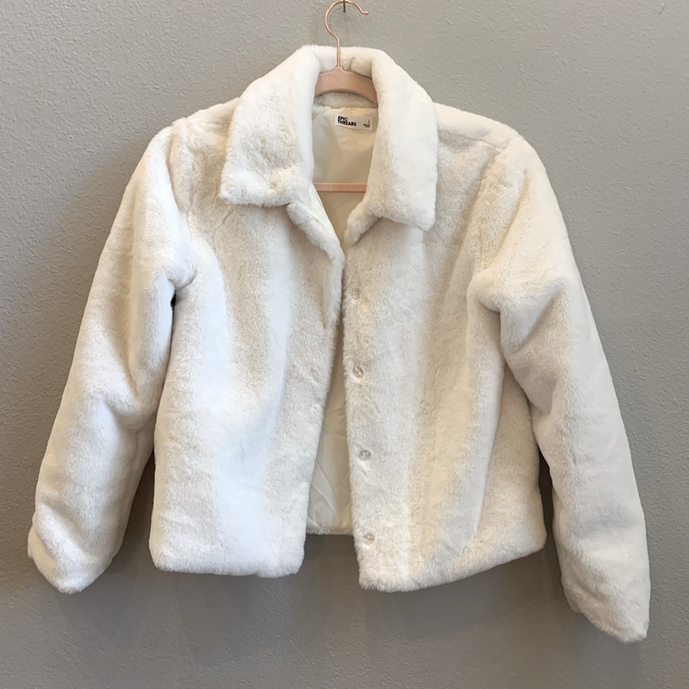 White faux fur coverlet.